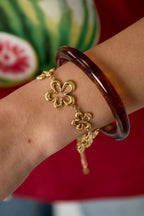 Armband Met Koraalvormige Speelse Bloemen In Variërende Maten