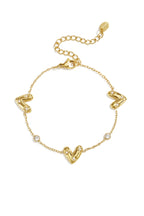 Armband Met Drie Belegde Harten En Ronde Zirkonia Steentjes